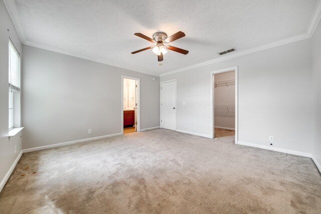 4838 Laura Jeanne Blvd, Murfreesboro, TN 37129 - unfurnished bedroom with ornamental molding, light colored carpet, baseboards, and a walk in closet