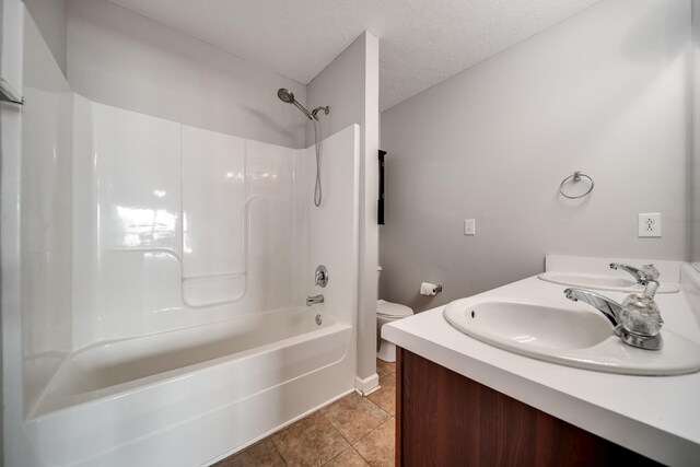 4838 Laura Jeanne Blvd, Murfreesboro, TN 37129 - bathroom with toilet, bathing tub / shower combination, a textured ceiling, double vanity, and tile patterned flooring