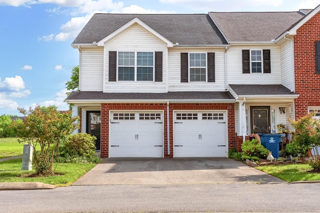 4838 Laura Jeanne Blvd, Murfreesboro, TN 37129 - townhome / multi-family property with driveway, an attached garage, brick siding, and a shingled roof