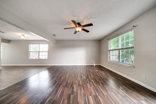 4838 Laura Jeanne Blvd, Murfreesboro, TN 37129 - spare room featuring dark wood-style floors, a textured ceiling, baseboards, and a ceiling fan
