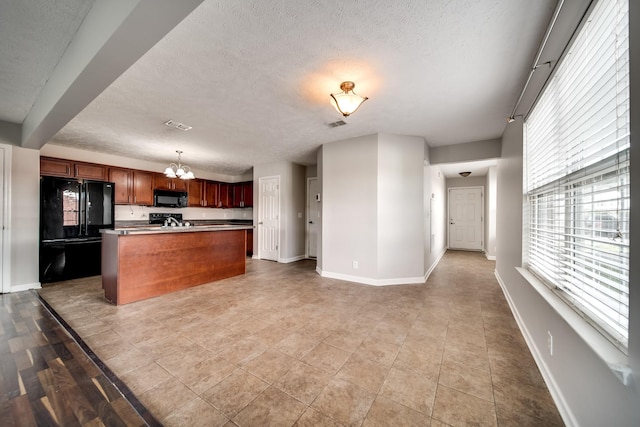 4838 Laura Jeanne Blvd, Murfreesboro, TN 37129 - kitchen featuring black appliances, a chandelier, a textured ceiling, open floor plan, and baseboards