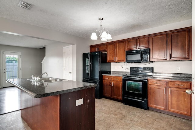 4838 Laura Jeanne Blvd, Murfreesboro, TN 37129 - kitchen with black appliances, a sink, dark countertops, a chandelier, and a kitchen island with sink