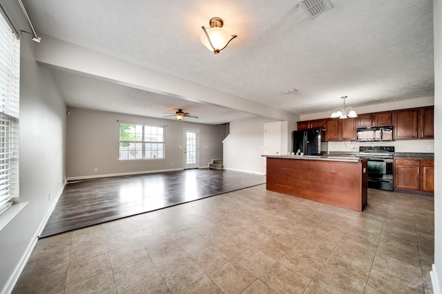 4838 Laura Jeanne Blvd, Murfreesboro, TN 37129 - kitchen with black appliances, a chandelier, open floor plan, baseboards, and ceiling fan