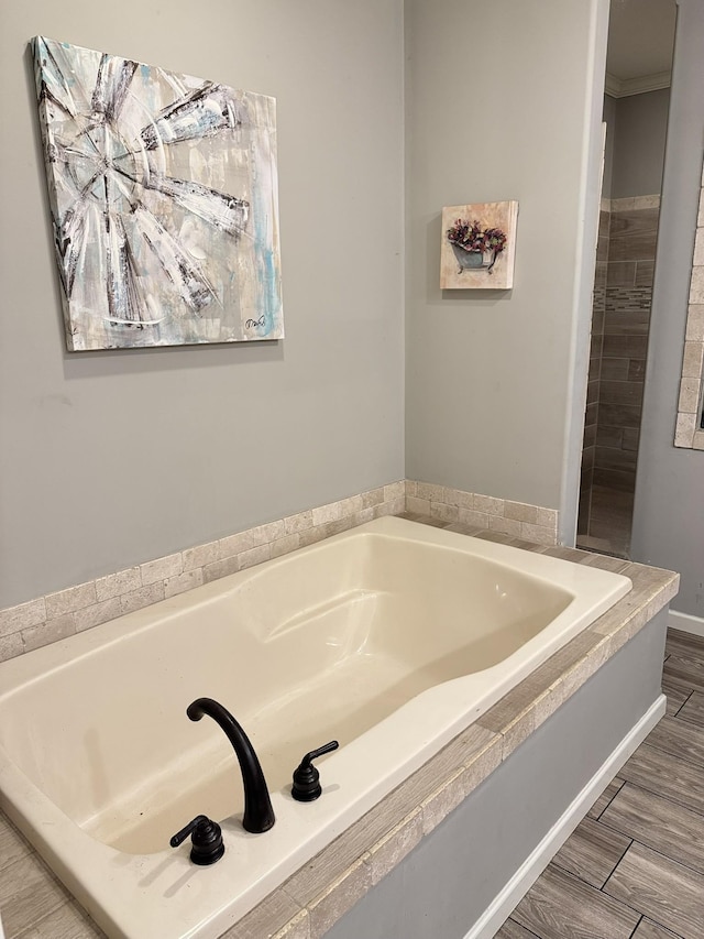 287 Sisk Rd, Winchester, TN 37398 - bathroom featuring a bath and wood finished floors