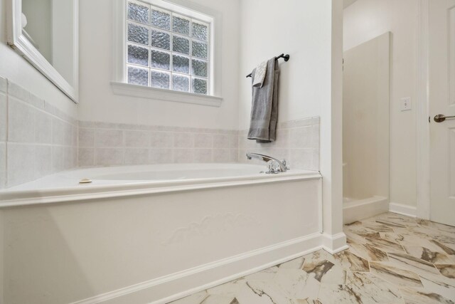 1403 Ottawa Pl, Murfreesboro, TN 37129 - bathroom with a garden tub, marble finish floors, baseboards, and a stall shower