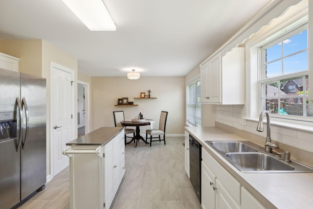 1403 Ottawa Pl, Murfreesboro, TN 37129 - kitchen featuring stainless steel refrigerator with ice dispenser, a sink, dishwasher, white cabinetry, and plenty of natural light