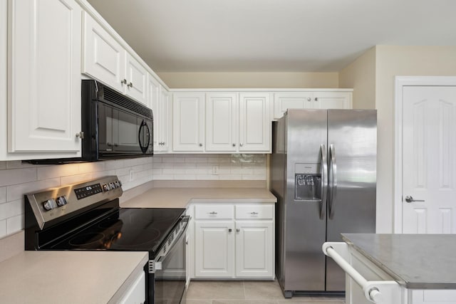 1403 Ottawa Pl, Murfreesboro, TN 37129 - kitchen with stainless steel appliances, white cabinets, tasteful backsplash, and light countertops