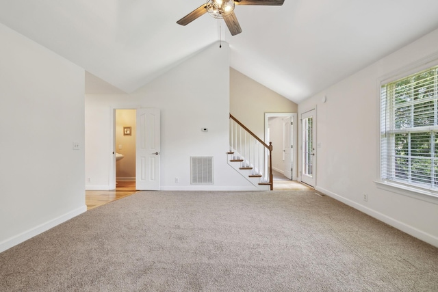 1403 Ottawa Pl, Murfreesboro, TN 37129 - unfurnished living room with light colored carpet, stairs, ceiling fan, vaulted ceiling, and baseboards