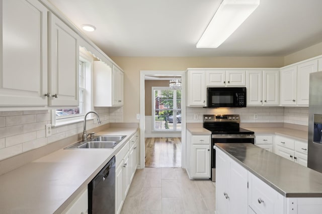 1403 Ottawa Pl, Murfreesboro, TN 37129 - kitchen featuring stainless steel appliances, a sink, white cabinetry, and backsplash