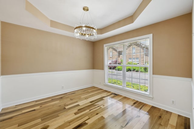 1403 Ottawa Pl, Murfreesboro, TN 37129 - spare room with a chandelier, wood finished floors, a raised ceiling, and baseboards