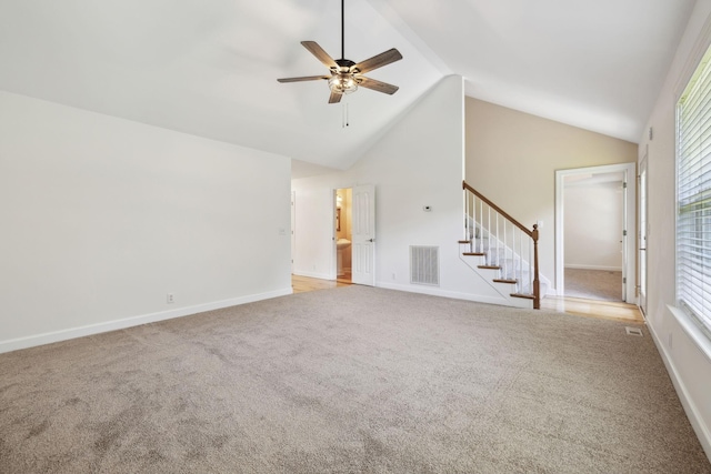 1403 Ottawa Pl, Murfreesboro, TN 37129 - unfurnished living room featuring light colored carpet, stairs, ceiling fan, lofted ceiling, and healthy amount of natural light