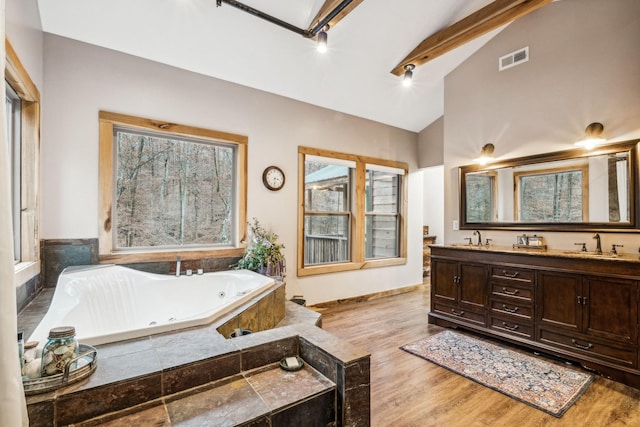 3560 Tyree Springs Rd, Hendersonville, TN 37075 - bathroom with beam ceiling, a tub with jets, wood finished floors, double vanity, and high vaulted ceiling