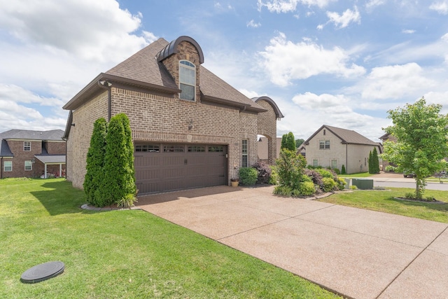 view of front facade with brick siding, a front yard, driveway, a garage, and a shingled roof
