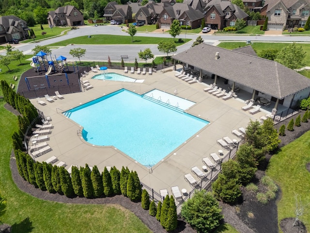 community pool with a residential view