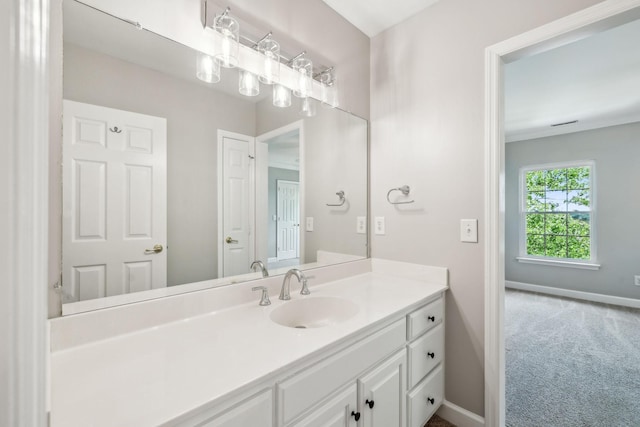 bathroom with baseboards and vanity