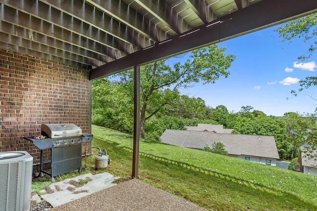 view of patio / terrace with area for grilling and central AC