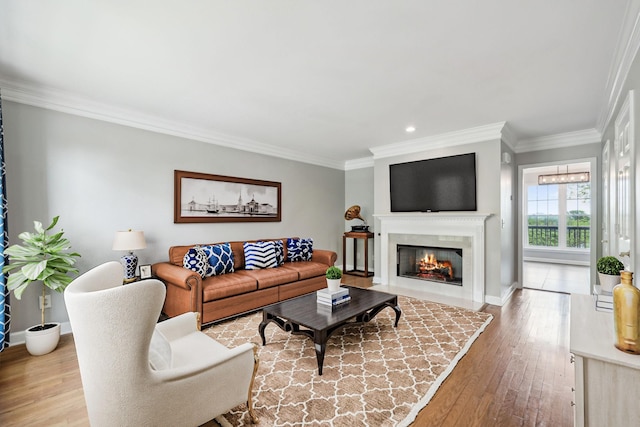 1621 Brentwood Pointe, Franklin, TN 37067 - living room with crown molding, hardwood / wood-style flooring, a fireplace with flush hearth, recessed lighting, and baseboards
