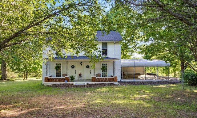 1885 N Soules Chapel Rd, Cunningham, TN 37052 - view of front of property with a porch, a front lawn, a carport, brick siding, and a shingled roof