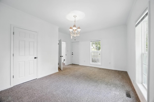 1885 N Soules Chapel Rd, Cunningham, TN 37052 - spare room featuring carpet, a chandelier, and baseboards