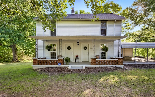1885 N Soules Chapel Rd, Cunningham, TN 37052 - view of front of property featuring a front lawn, covered porch, a chimney, and brick siding