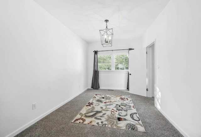 1885 N Soules Chapel Rd, Cunningham, TN 37052 - carpeted spare room with a chandelier and baseboards