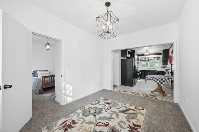 1885 N Soules Chapel Rd, Cunningham, TN 37052 - hallway with light colored carpet, a chandelier, and baseboards