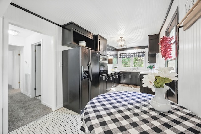 1885 N Soules Chapel Rd, Cunningham, TN 37052 - kitchen with black fridge, light colored carpet, a sink, light countertops, and oven