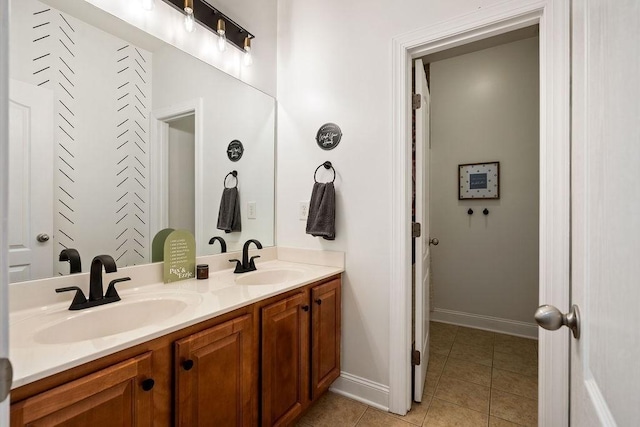 2184 Loudenslager Dr, Thompsons Station, TN 37179 - full bathroom with double vanity, tile patterned floors, and baseboards