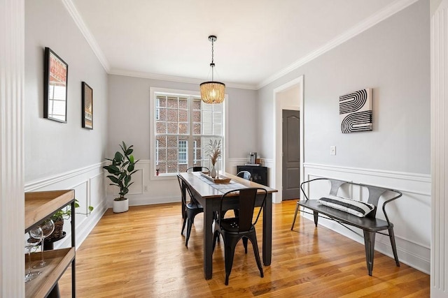 2184 Loudenslager Dr, Thompsons Station, TN 37179 - dining room with crown molding, light wood-type flooring, a wainscoted wall, and a decorative wall
