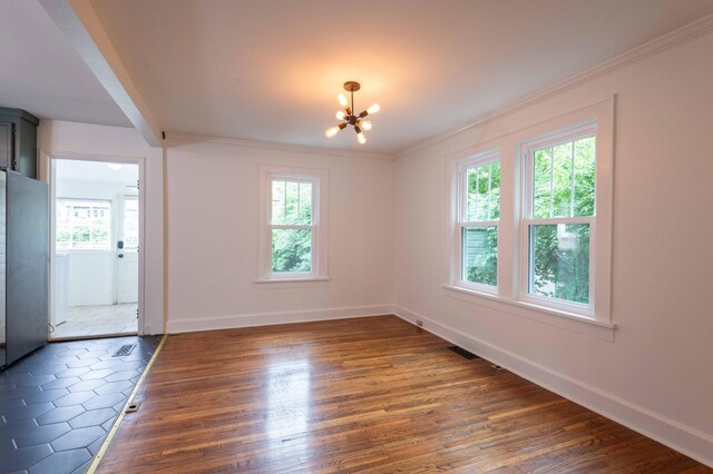 2219 Blair Blvd, Nashville, TN 37212 - empty room featuring a chandelier, plenty of natural light, baseboards, and ornamental molding