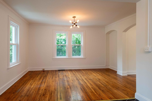 2219 Blair Blvd, Nashville, TN 37212 - unfurnished room with plenty of natural light, dark wood finished floors, a chandelier, baseboards, and crown molding
