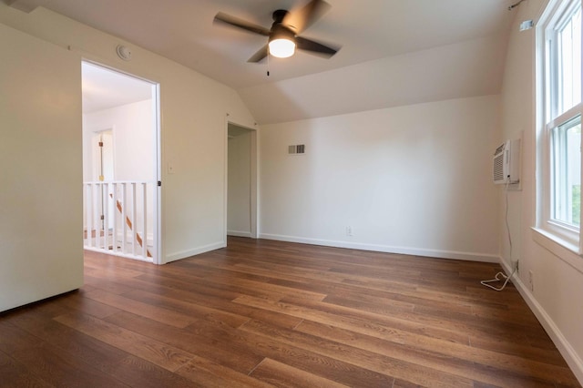 2219 Blair Blvd, Nashville, TN 37212 - empty room with a ceiling fan, dark wood-style flooring, vaulted ceiling, an AC wall unit, and baseboards