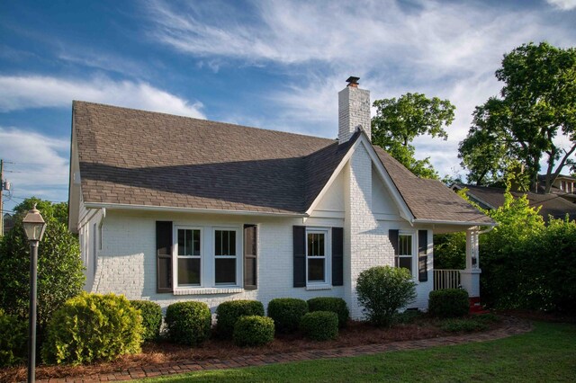 2219 Blair Blvd, Nashville, TN 37212 - view of side of property with a chimney, a shingled roof, and brick siding