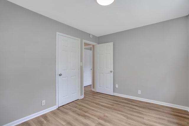 1454 Elm Hill Dr, Clarksville, TN 37040 - unfurnished bedroom featuring light wood finished floors and baseboards
