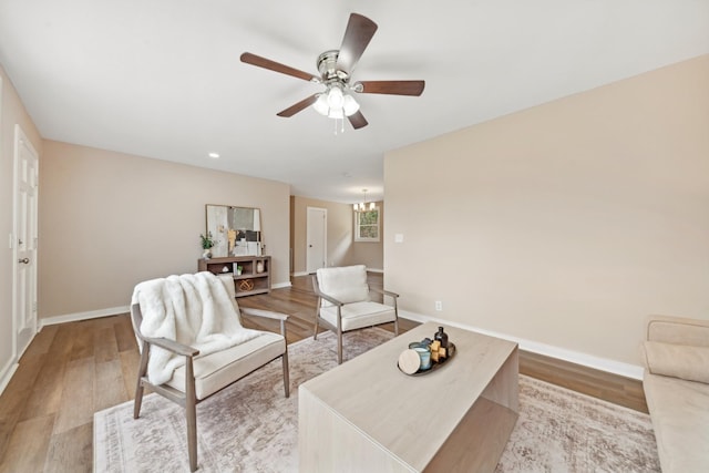 1614 Shady Cir, Lebanon, TN 37087 - living area with light wood finished floors, a ceiling fan, baseboards, a chandelier, and recessed lighting