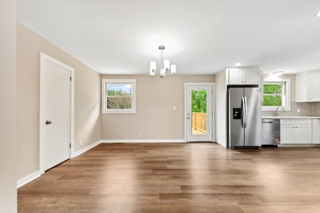 1614 Shady Cir, Lebanon, TN 37087 - kitchen featuring stainless steel appliances, healthy amount of natural light, a chandelier, light wood finished floors, and recessed lighting