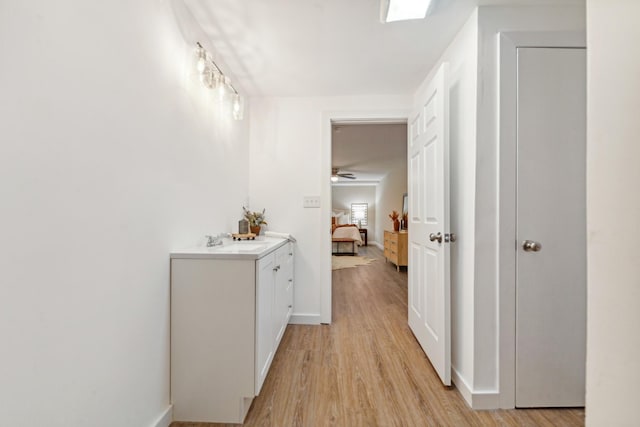 1614 Shady Cir, Lebanon, TN 37087 - corridor with light wood-type flooring, baseboards, and a sink