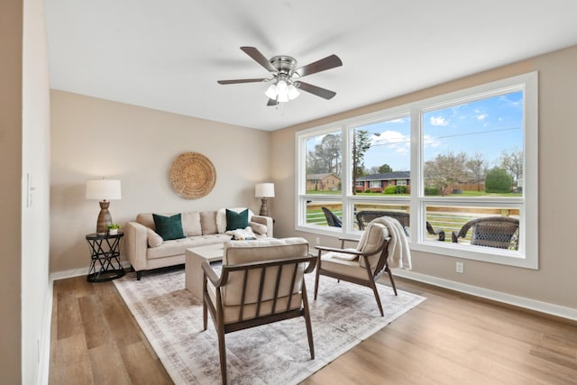 1614 Shady Cir, Lebanon, TN 37087 - living area with light wood-style flooring, baseboards, and a ceiling fan