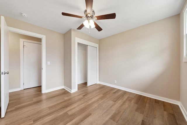 1614 Shady Cir, Lebanon, TN 37087 - unfurnished bedroom with baseboards, light wood-style flooring, ceiling fan, and a closet