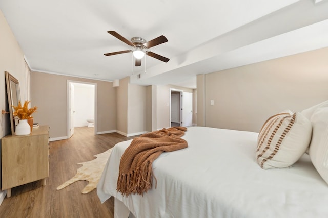 1614 Shady Cir, Lebanon, TN 37087 - bedroom featuring wood finished floors, baseboards, ensuite bathroom, and ceiling fan