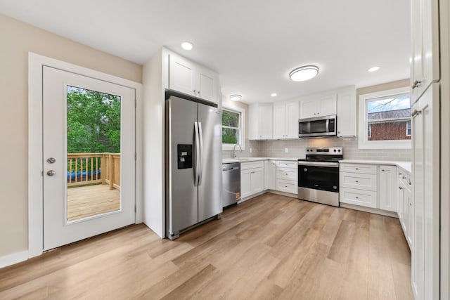 1614 Shady Cir, Lebanon, TN 37087 - kitchen featuring stainless steel appliances, a sink, light wood-style flooring, healthy amount of natural light, and recessed lighting