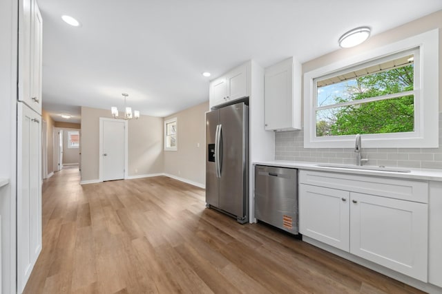 1614 Shady Cir, Lebanon, TN 37087 - kitchen featuring appliances with stainless steel finishes, a sink, white cabinets, light countertops, and recessed lighting