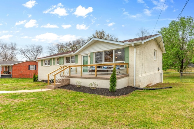 1614 Shady Cir, Lebanon, TN 37087 - view of front of house with brick siding, a sunroom, and a deck