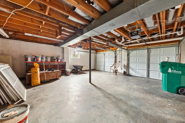 1614 Shady Cir, Lebanon, TN 37087 - garage featuring a garage door opener and concrete block wall