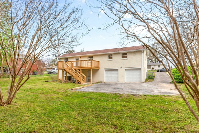 1614 Shady Cir, Lebanon, TN 37087 - back of property featuring stairway, asphalt driveway, an attached garage, a wooden deck, and brick siding