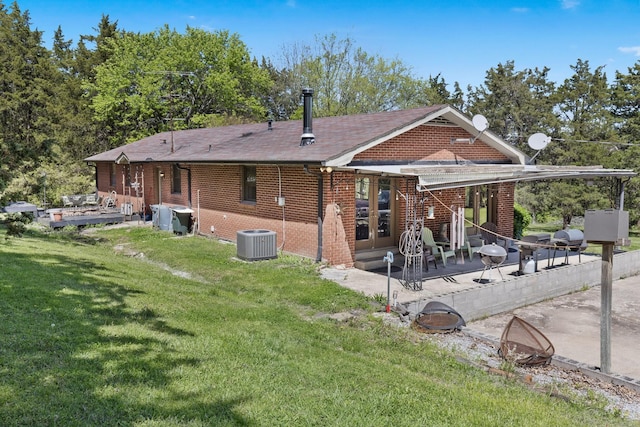 1515 Owen Rd, Brentwood, TN 37027 - rear view of house featuring brick siding, a patio, a yard, cooling unit, and a deck