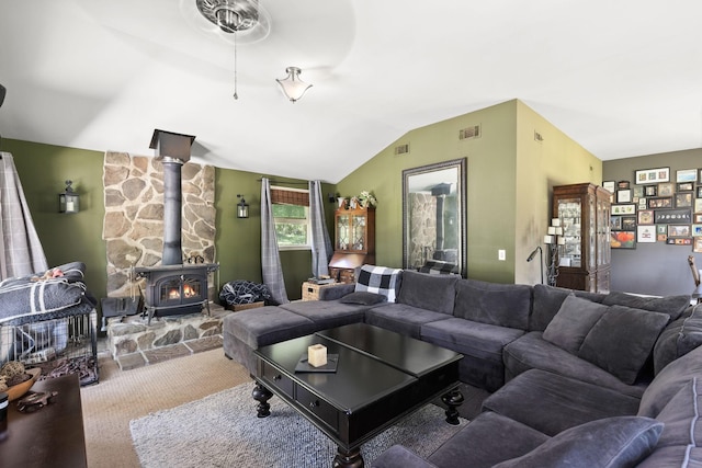 1515 Owen Rd, Brentwood, TN 37027 - carpeted living room featuring a wood stove, vaulted ceiling, and a ceiling fan