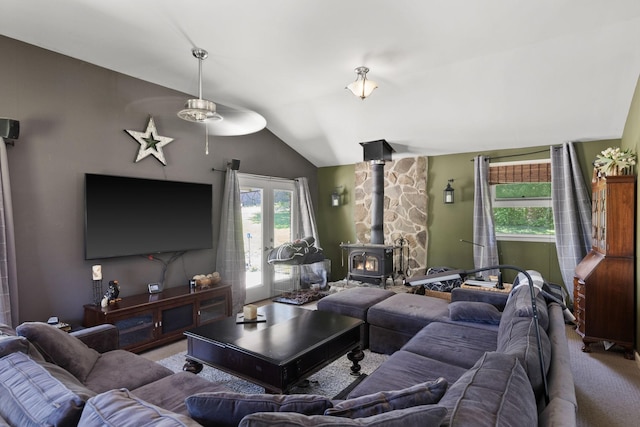 1515 Owen Rd, Brentwood, TN 37027 - living room with carpet flooring, ceiling fan, a wood stove, and lofted ceiling