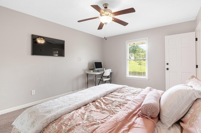 carpeted bedroom with baseboards and a ceiling fan