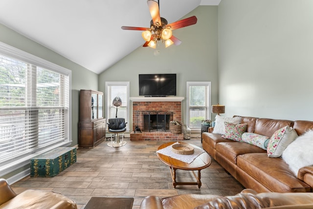 707 Bradford Pl, Murfreesboro, TN 37130 - living room with ceiling fan, healthy amount of natural light, high vaulted ceiling, wood finished floors, and a brick fireplace